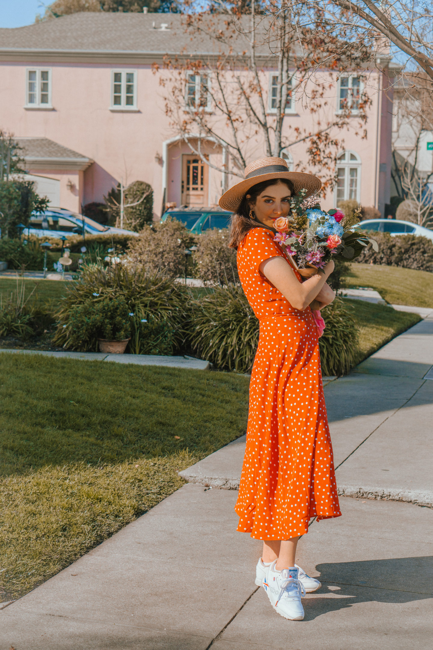 Sporty chic brunch outfit idea, orange spring dress with white sneakers and a straw hat  - Palm Trees and Pellegrino