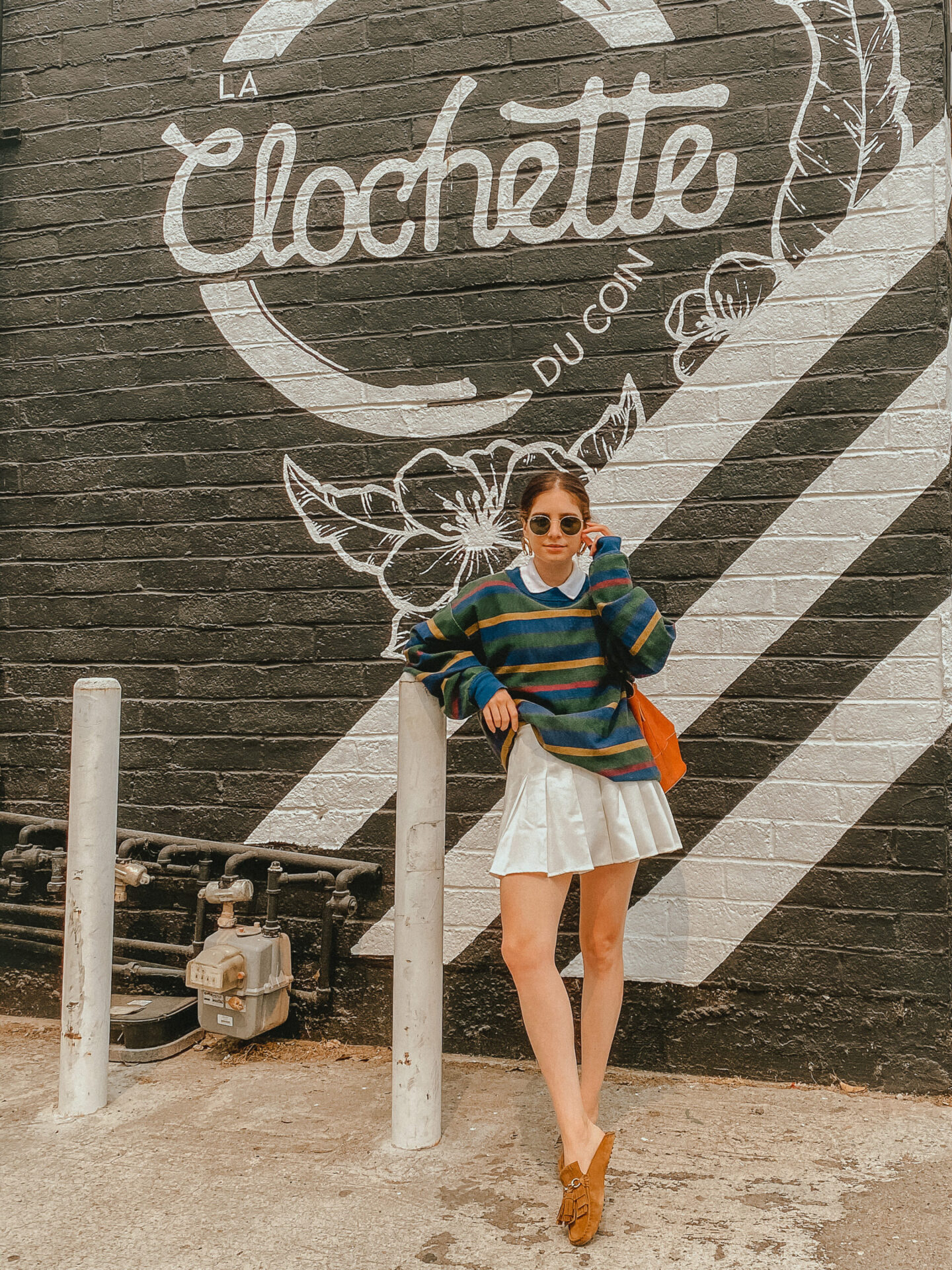 Preppy sweater layered over a white collar shirt and a tennis skirt Pinterest outfit - Palm Trees and Pellegrino